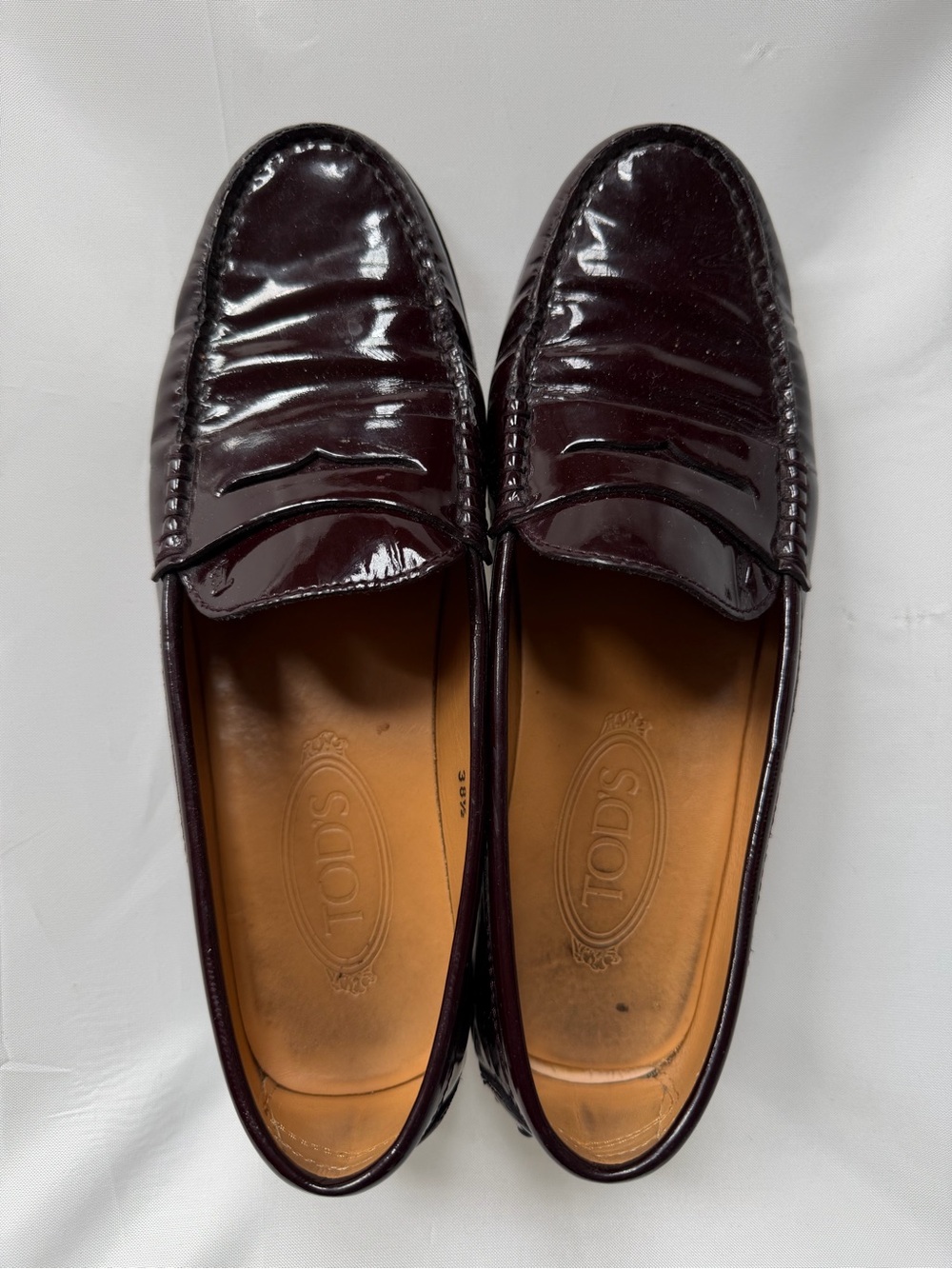 Tod’s Women’s Dark Burgundy Patent Leather Penny Loafers